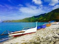 Grey beach and the four boats Royalty Free Stock Photo