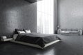 Grey bedroom  bed with linens and sofa on marble floor near window Royalty Free Stock Photo