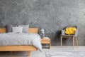 Grey bedroom with armchair Royalty Free Stock Photo