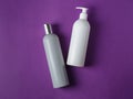 Grey blank shampoo and white conditioner cosmetic bottles