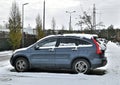 Grey blue high old veteran car Honda CR-V third generation pre-facelift parked in snow