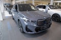 grey BMW iX1 mid-size electric SUV German manufacturer BMW AG, Powerful electric motor, Advanced technology in automotive industry