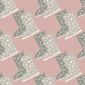 Grey boots silhouettes seamless pattern. Light lilac background. Rubber shoes autumn print Royalty Free Stock Photo