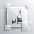 Grey Bottle of vodka with glass icon isolated on grey background. Square glass panels. Vector