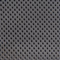 Grey breathable porous poriferous material for air ventilation with holes