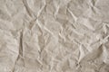 Grey-brown crumpled wrapping paper background, texture of grey wrinkled of old vintage paper