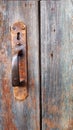 Grey and brown Wooden Door Planking Texture with vintage door handle. Royalty Free Stock Photo