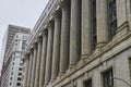 Grey building with pillars and columns on overcast day with gloomy, ominous sky, Chicago, IL Royalty Free Stock Photo