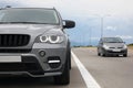 Grey modern car parked on asphalt road Royalty Free Stock Photo