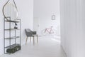 Grey chair in minimalist corridor