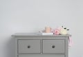 Grey chest of drawers on background