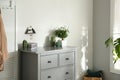 Grey chest of drawers in room