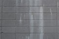 Grey cinder block wall with paint stains Royalty Free Stock Photo