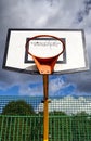 Sunlight on orange basketball hoop and board. Royalty Free Stock Photo