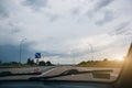 Grey clouds and sky from the driver`s view. Windscreen wipers. Travel lifestyle concept