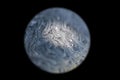 Grey colored cold alien planet, spotlighted by the sun with an atmosphere in universe on dark background. Soap bobble