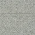 Grey concrete tiles arranged in a geometric pattern of interconnected hexagons and Royalty Free Stock Photo