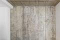 Grey concrete wall. Clay wall texture with cracks and imperfections. Modern interior concept. Royalty Free Stock Photo