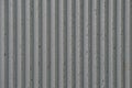 grey concrete wall with deep textured 3d lines vertical