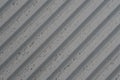 grey concrete wall with deep textured 3d lines diagonal