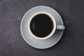 Grey cup with black coffee on on dark background. Top view. Coffee break Royalty Free Stock Photo