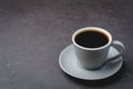 Grey cup with black coffee on on dark table. Selective focus and copy space. Coffee break Royalty Free Stock Photo