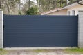 Grey dark house steel sliding door aluminum gate at modern home entrance Royalty Free Stock Photo