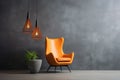 Grey decorative vase and orange pendant light near leather wingback chair against concrete stucco wall Royalty Free Stock Photo