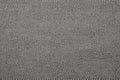 Grey denim background.The texture of denim grey fabric is fluted in light stripes.