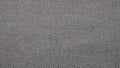 Grey denim background.The texture of denim grey fabric is fluted in light stripes.