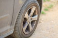 Grey dirty car wheel close-up Royalty Free Stock Photo