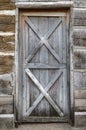 Grey Door in Log Cabin Wall