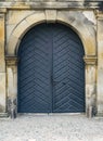 Grey door in marble wall