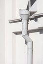 Grey drainpipe on wall