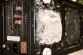 Grey dust on the computer pc processor cooler with mainboard and computer case fragment