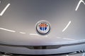 grey electric Fisker Ocean in showroom, Logo on cap, trends EV in Europe, technological advancements automotive industry,