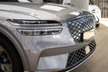 grey electric Hyundai Genesis GV70 in Studio, popular korean passenger Electric SUV vehicle in showroom, alternative energy