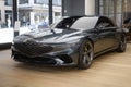 grey electric Hyundai Genesis GV70 in Studio, popular korean passenger Electric SUV vehicle in showroom, alternative energy