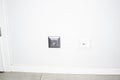 Grey electric socket in white wall Royalty Free Stock Photo