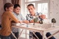 Grey-eyed tutor teaching his pupils dendrology Royalty Free Stock Photo