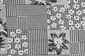 Grey fabric background with flower pattern close-up Royalty Free Stock Photo