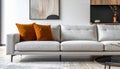 Grey Fabric Sofa with Orange Pillows in Modern Living Room Royalty Free Stock Photo