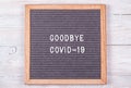 grey felt Board with the English goodbye covid-19