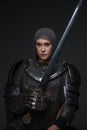 on grey female knight holding steel sword
