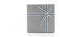Grey gift box with ribbon on white background, copy space Royalty Free Stock Photo