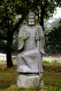 Grey granit statue of man sitting