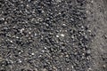 Grey gravel texture. Rustic road surface top view photo. Off-road ride or drive concept. Black gravel stone with sand Royalty Free Stock Photo