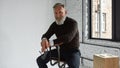 Grey hair confident caucasian man sitting on chair