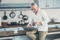 Grey-haired businessman reading morning news Royalty Free Stock Photo