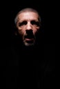 Grey haired man with opened mouth and scaring look Royalty Free Stock Photo